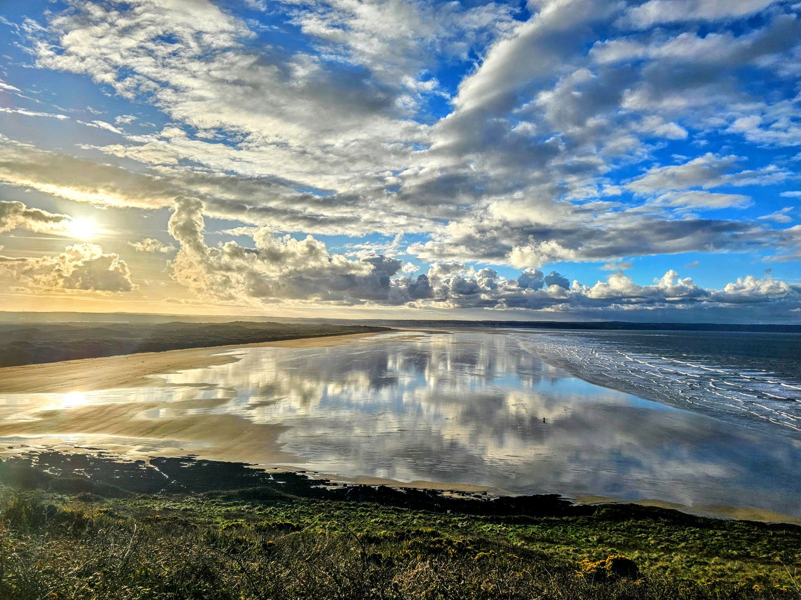 Wide North Devon beach at low tide under a big sky