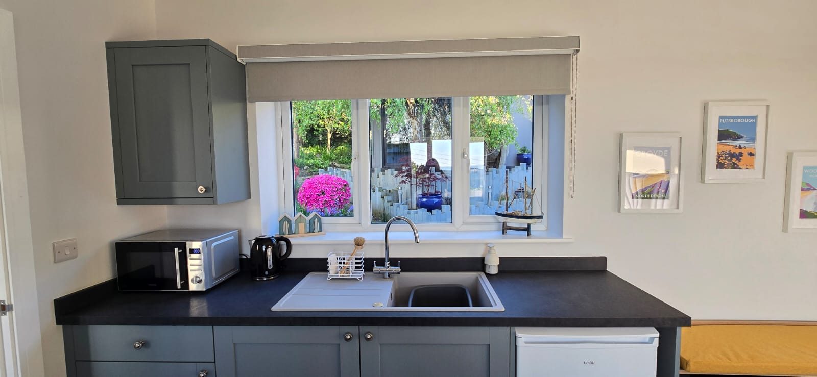 The self-contained kitchenette with microwave, kettle and sink