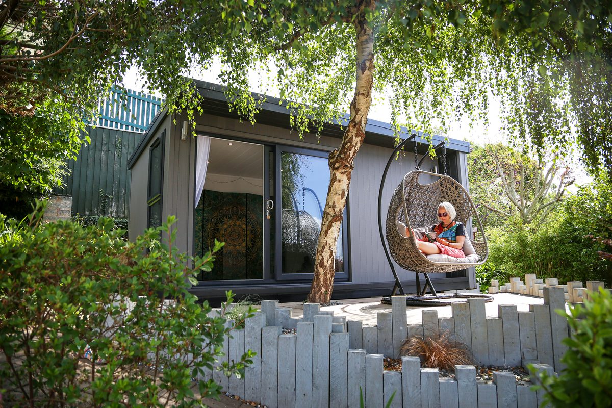 The on-site garden studio, with a hanging egg chair outside